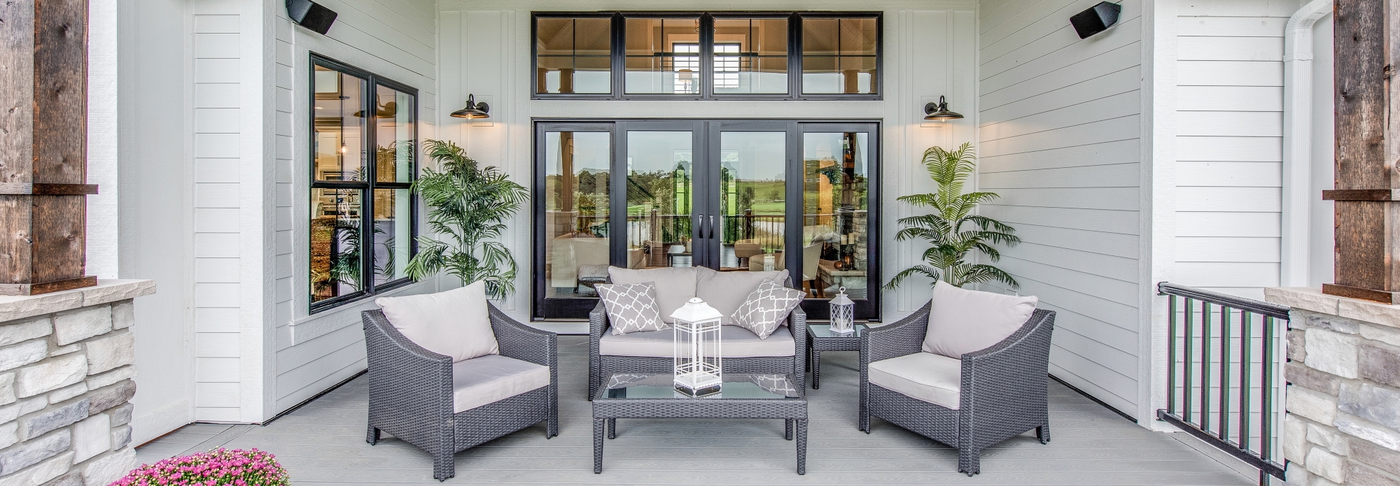 Wood panel vaulted covering on outdoor gathering area of new home